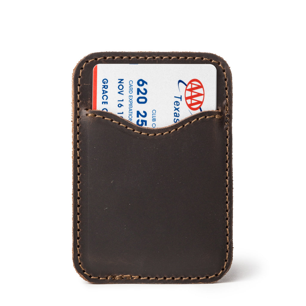 Slim Leather Card Wallet in Dark Coffee Brown, back view with a card tucked in the curved pocket