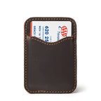 Slim Leather Card Wallet in Dark Coffee Brown, back view with a card tucked in the curved pocket