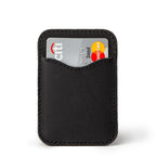 Slim Leather Card Wallet in Black, back view with a debit card tucked in the curved pocket