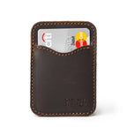 Slim Leather Card Wallet in Dark Coffee Brown, front view with a debit card tucked in the curved pocket