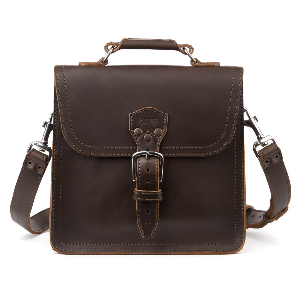 Indiana Leather Satchel in Dark Coffee Brown, front view with buckled flap, top handle and clipped shoulder strap