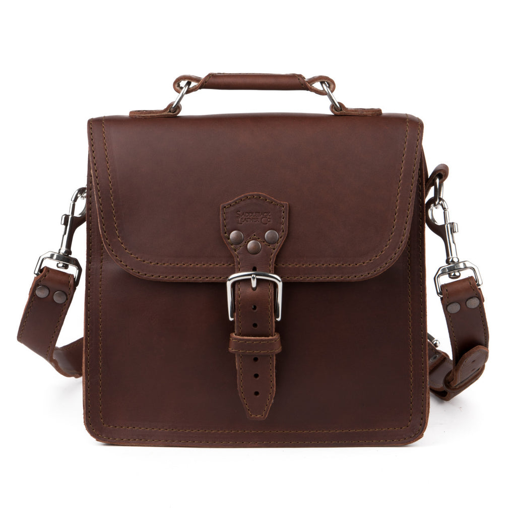 Indiana Leather Satchel in Chestnut, front view with buckled flap, top handle and clipped shoulder strap