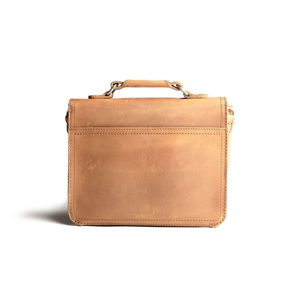 Front Pocket Leather Satchel in Tobacco, back view with top handle and stitched back panel