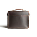 Front Pocket Leather Satchel in Dark Coffee Brown, back view with top handle and stitched back panel