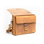 Front Pocket Leather Satchel in Tobacco with the flap folded back to reveal the buckled front pocket