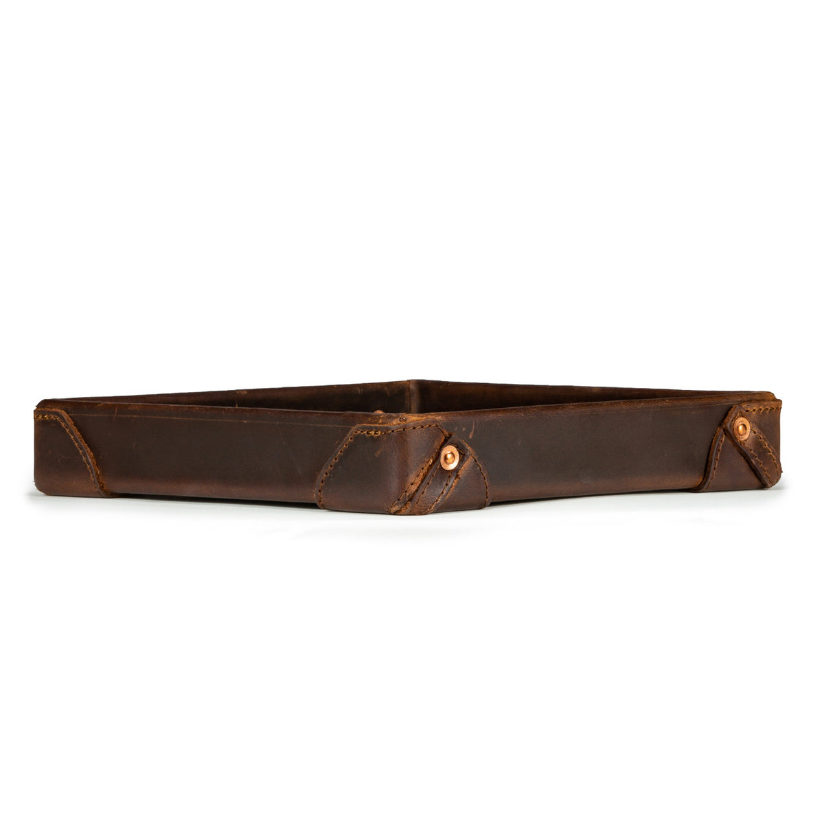 The Leather Grandfather Valet Tray in Dark Coffee Brown, low side view showing stitched corner tabs with rivets