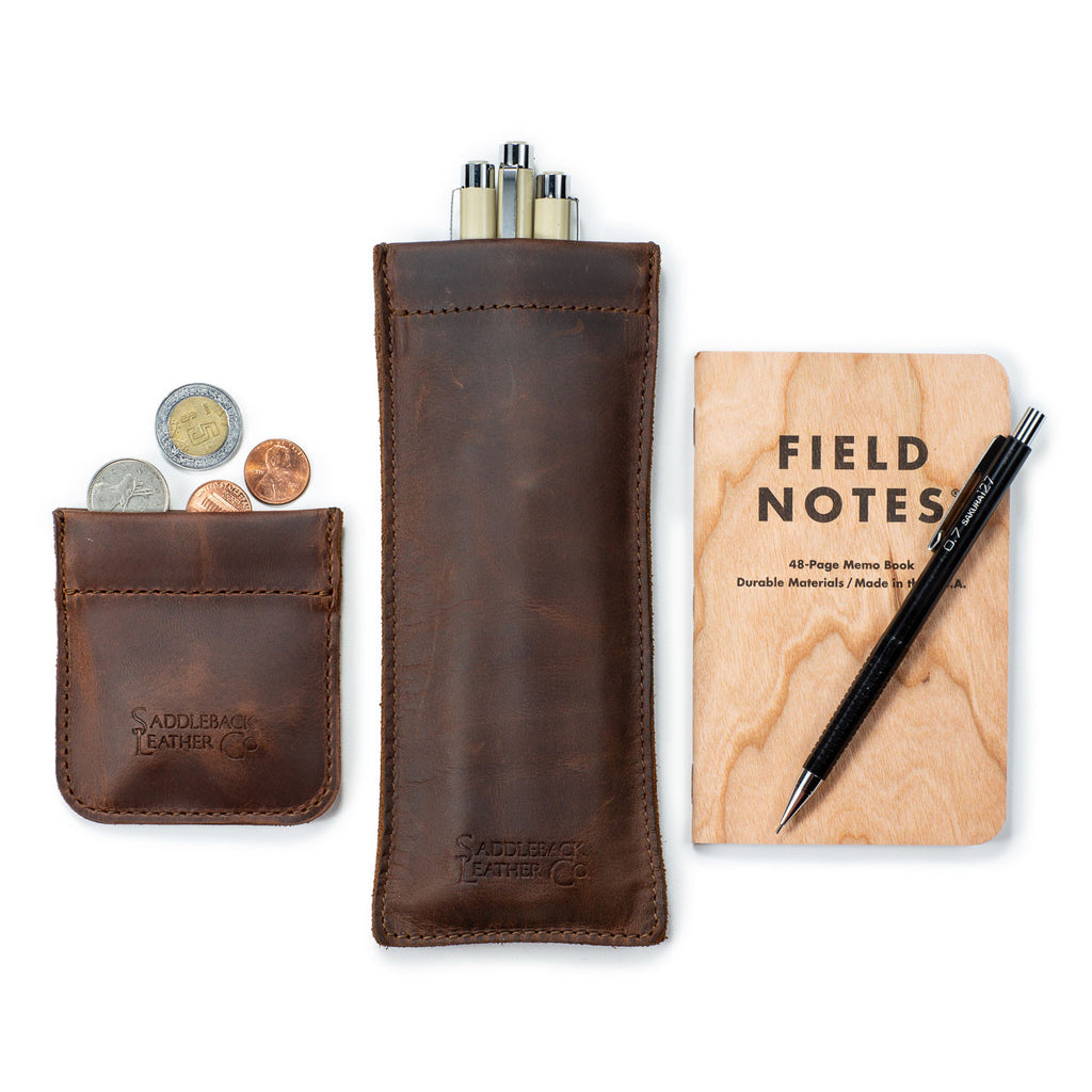 Bear Trap Leather Coin Purse in Dark Coffee Brown with coins, beside a matching pen case and a pocket notebook