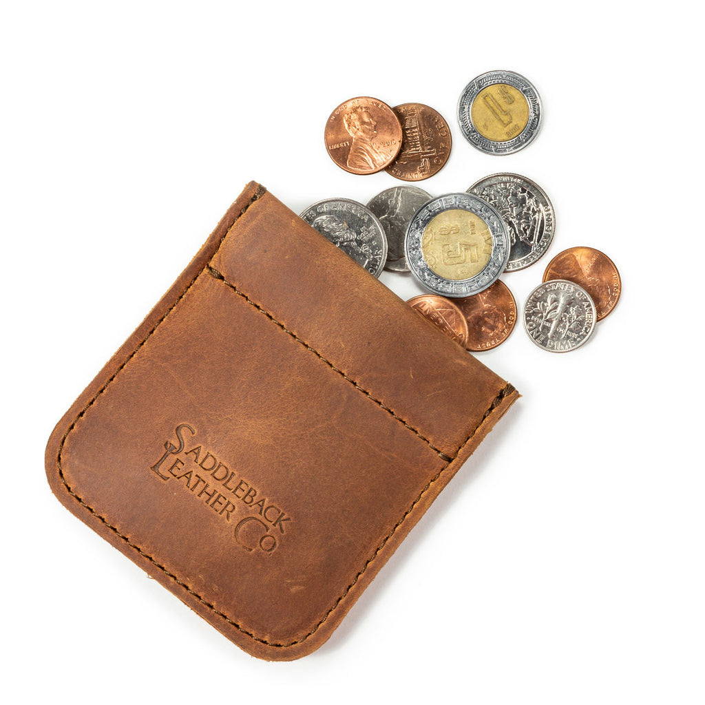 Bear Trap Leather Coin Purse in Tobacco with coins spilling out and embossed Saddleback Leather Co. logo