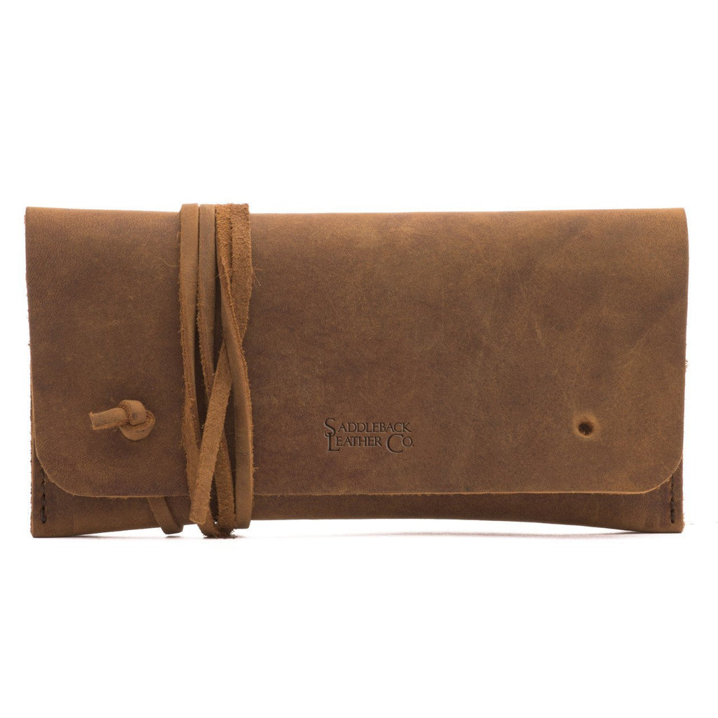 Cash & Receipt Bag in Tobacco, closed flap with wrapped leather tie and embossed logo, front view