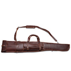 Shotgun Sleeve in Chestnut, side view with buckled pocket, carry handle and shoulder strap