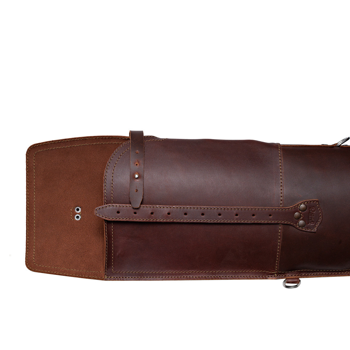 Shotgun Sleeve in Chestnut, close-up of the end flap opened to show the suede underside and closure strap