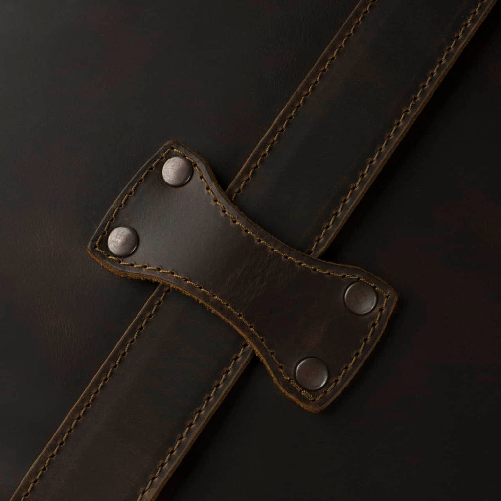 Leather Trunk in Dark Coffee Brown, close-up of riveted strap keeper over a stitched strap