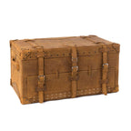 Leather Trunk in Tobacco, closed angled view with buckled straps, side handle and studded trim