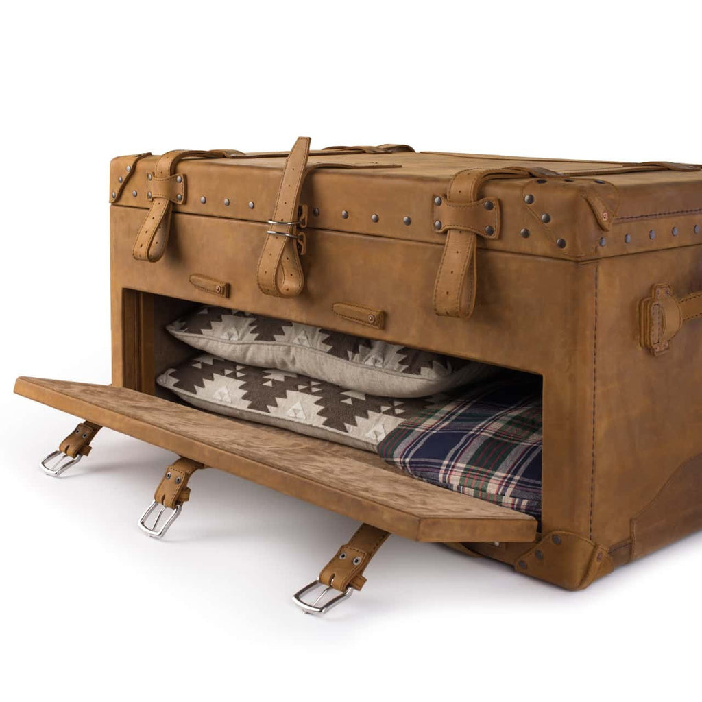 Leather Trunk in Tobacco, angled view with drop-front drawer open to show folded blankets and a flannel shirt