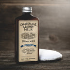 Chamberlain's Water Protectant No. 3 leather protector bottle beside an applicator pad on a wooden surface