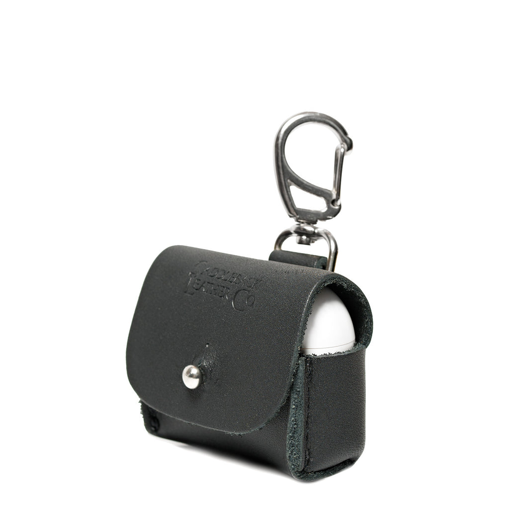 Leather AirPods Pro Case in Black, angled front view with embossed logo, stud closure and carabiner clip