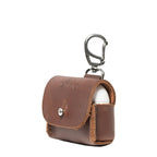 Leather AirPods Pro Case in Chestnut, angled front view with embossed logo, stud closure and carabiner clip