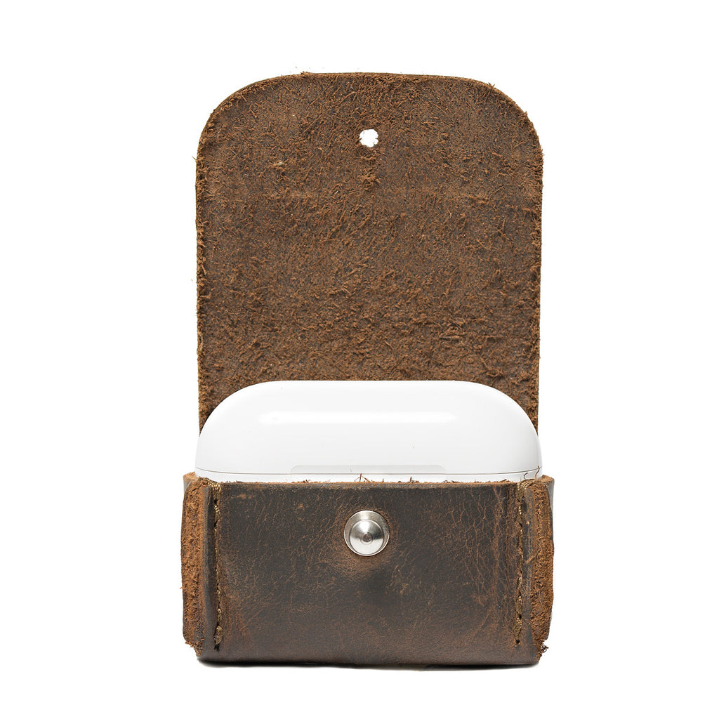 Leather AirPods Pro Case in Dark Coffee Brown, flap open showing the suede lining and closed charging case inside