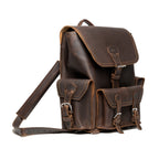 Front Pocket Leather Backpack in Dark Coffee Brown, angled view with buckled flap, front pockets and strap