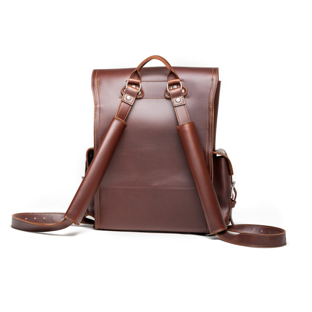 Front Pocket Leather Backpack in Chestnut, back view with padded shoulder straps and top handle