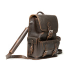 Thin Front Pocket Leather Backpack in Dark Coffee Brown, angled view with buckled flap, front pocket and strap