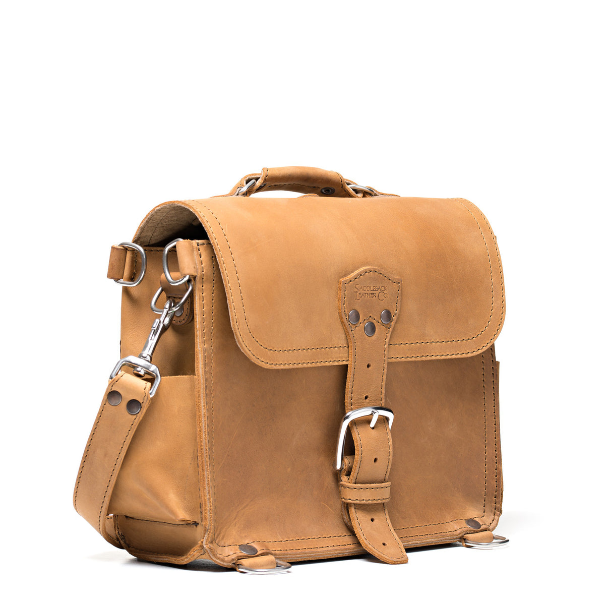 Photographer's Satchel in Tobacco, angled front view with buckled flap and shoulder strap clip