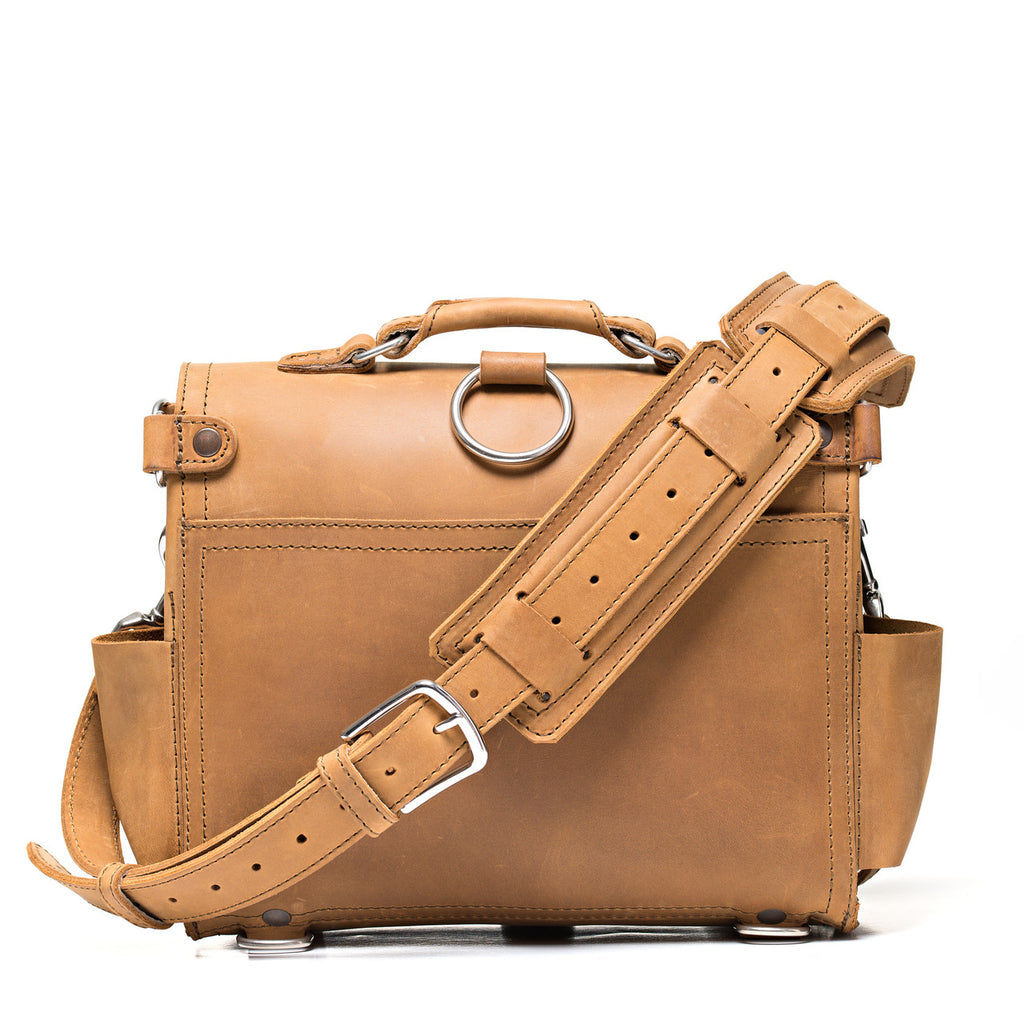 Photographer's Satchel in Tobacco, back view with shoulder strap and pad attached