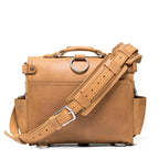 Photographer's Satchel in Tobacco, back view with shoulder strap and pad attached