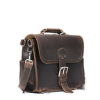 Photographer's Satchel in Dark Coffee Brown, angled front view with buckled flap and shoulder strap