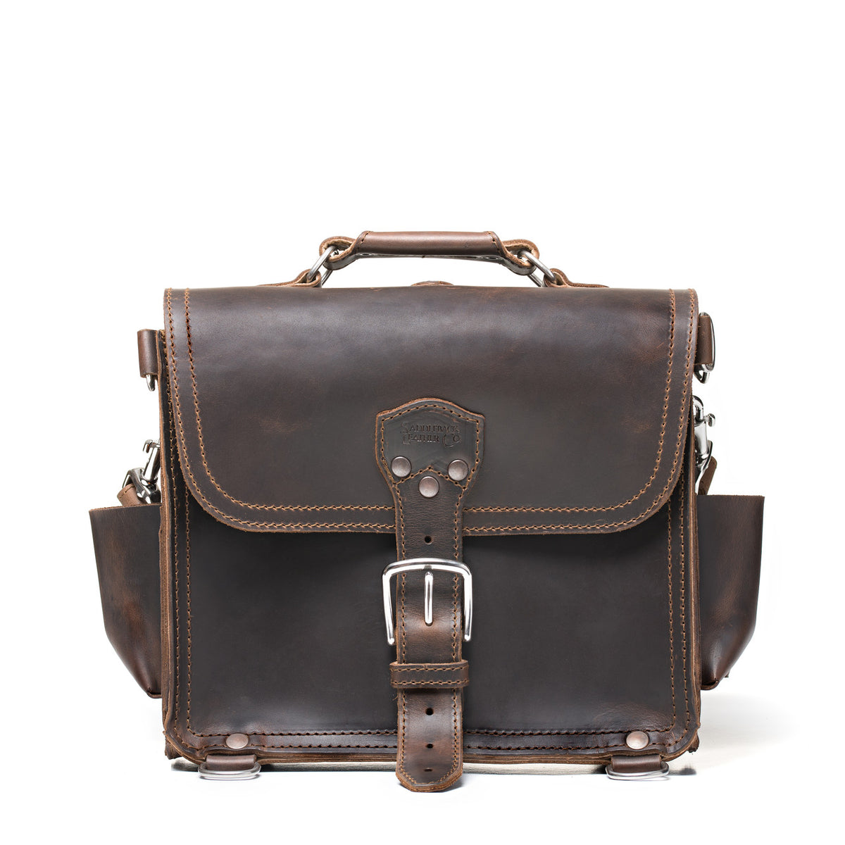 Photographer's Satchel in Dark Coffee Brown, front view with buckled flap, top handle and side pockets