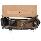 Photographer's Satchel in Dark Coffee Brown, top view open with a passport, keys and notebook inside