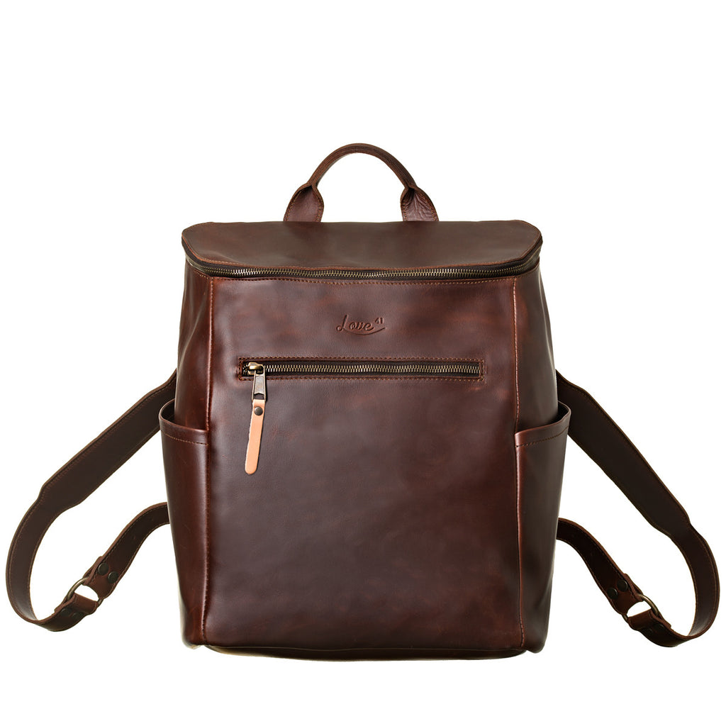 All in One Leather Backpack in Chestnut, front view showing zippered pocket, side pockets and straps