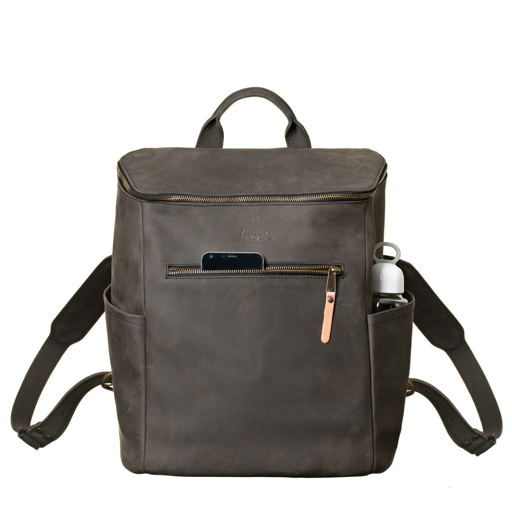 All in One Leather Backpack in Black, front view with a phone in the front pocket and bottle in the side
