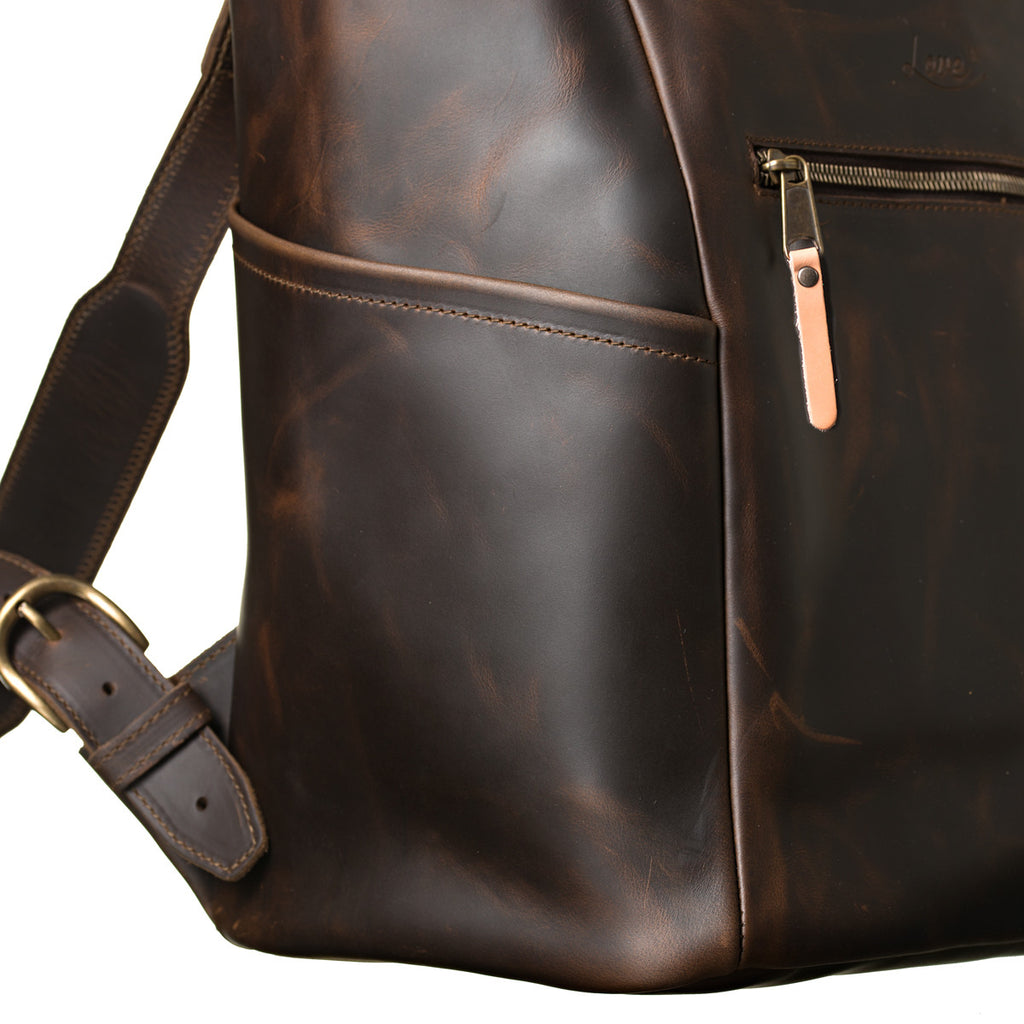 All in One Leather Backpack in Dark Coffee Brown, close-up of side pocket, zipper pull and strap buckle
