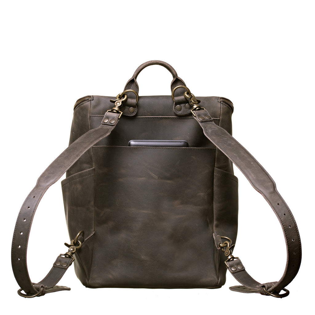 All in One Leather Backpack in Black, back view showing adjustable shoulder straps and back slip pocket