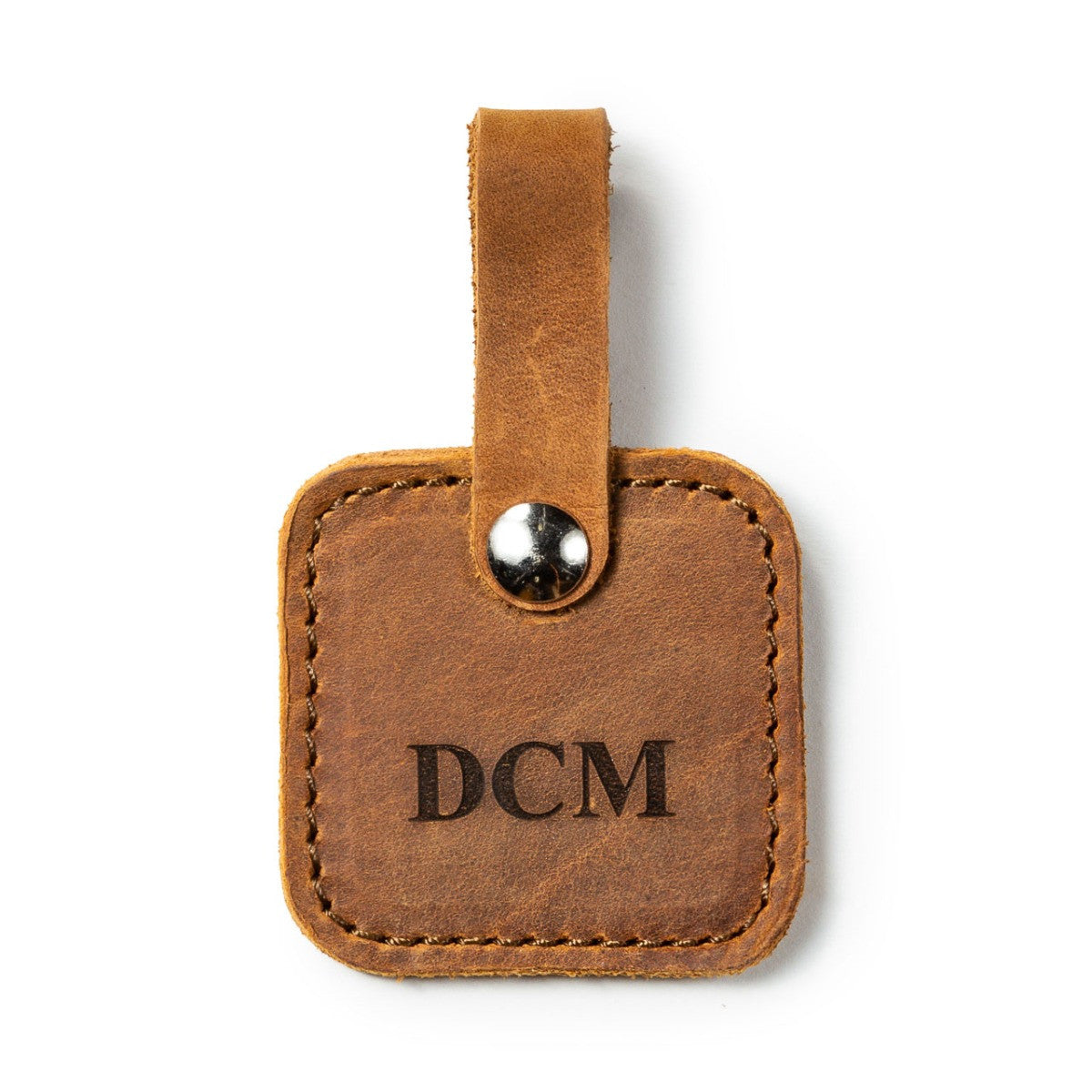 Leather Bag Tag in Tobacco with snap strap, personalized with an engraved DCM monogram