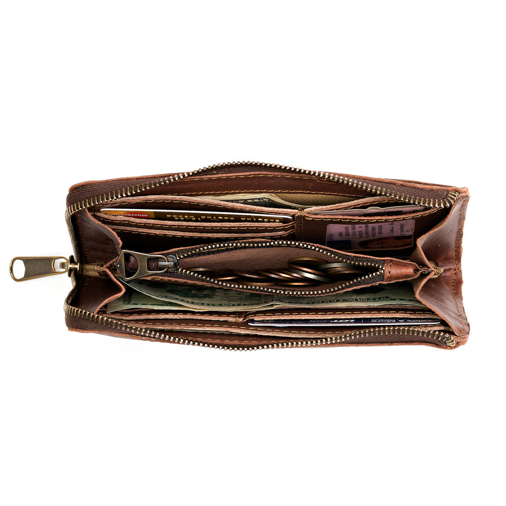 Medium Wristlet Leather Wallet in reddish brown, unzipped showing cards, cash and coin pocket