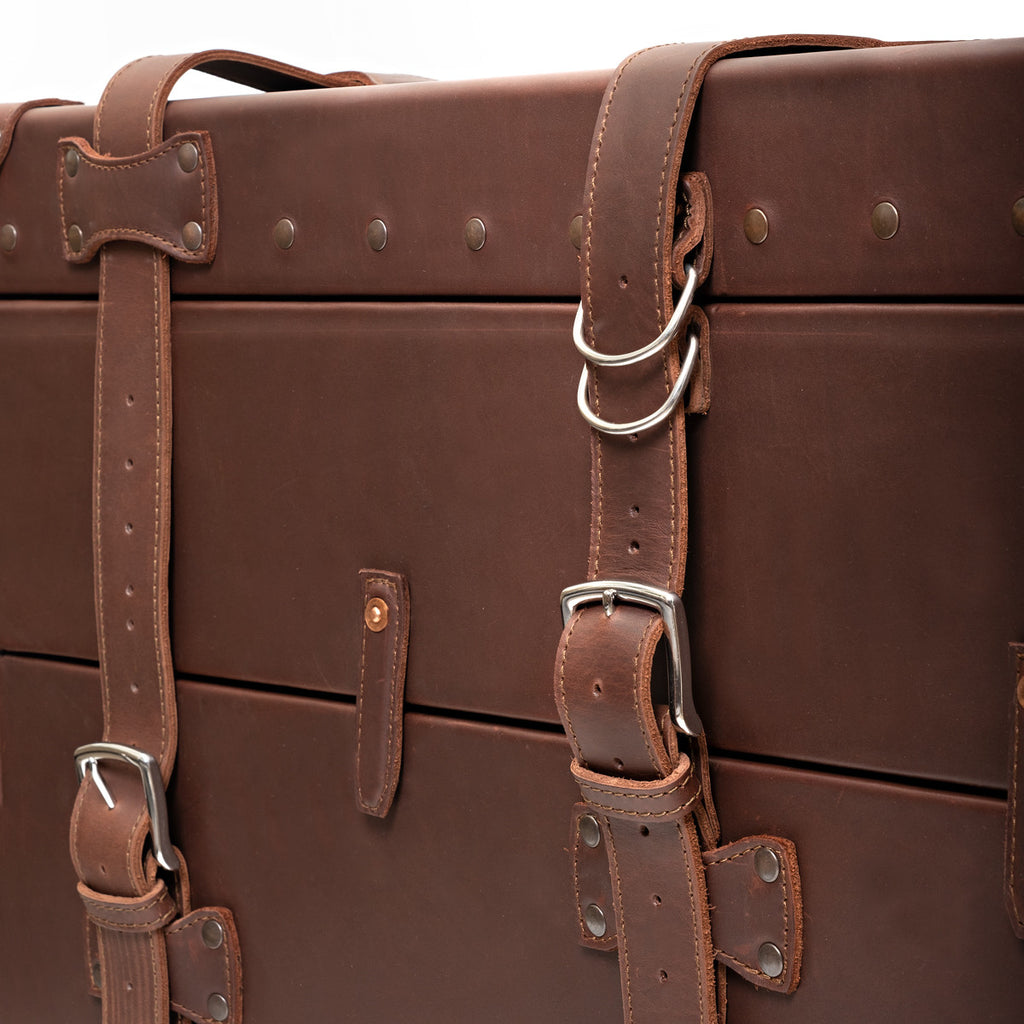 Leather Trunk in Chestnut, close-up of front straps with silver buckles and D-rings
