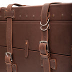 Leather Trunk in Chestnut, close-up of front straps with silver buckles and D-rings
