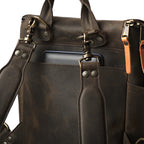 All in One Backpack Medium in Black, close-up of back panel with swivel clips, rivets and laptop sleeve