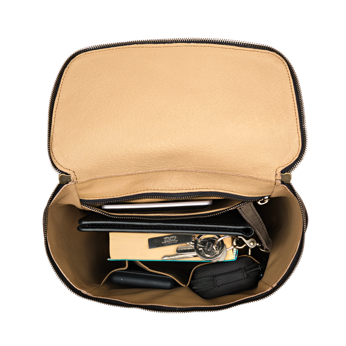 All in One Backpack Medium in Black, open top view of lined interior packed with keys, wallet and pouches
