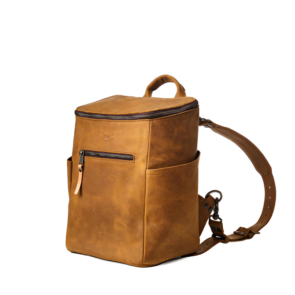 All in One Backpack Medium in Tobacco, angled front view with side pocket and shoulder strap
