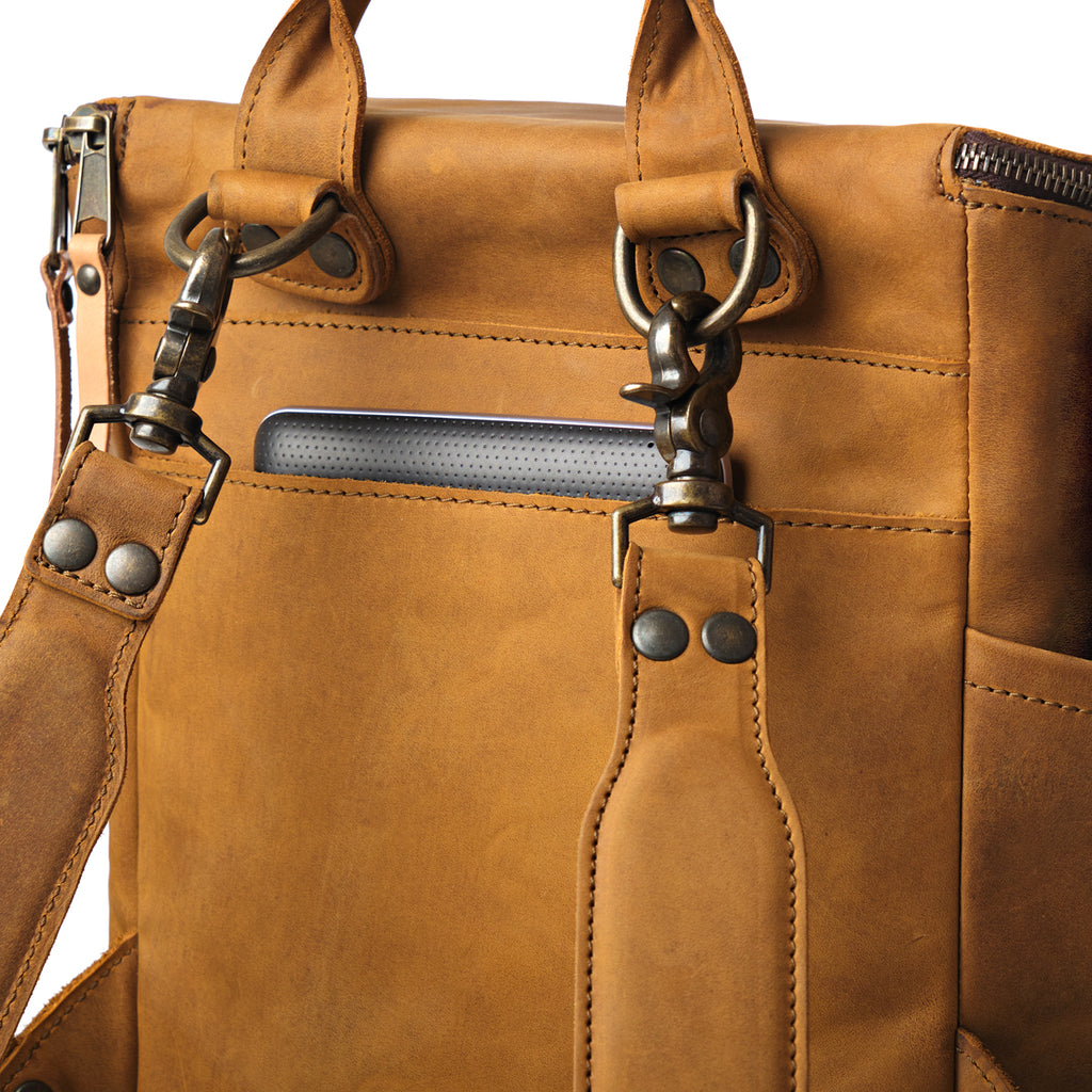 All in One Backpack Medium in Tobacco, close-up of back panel with swivel clips, rivets and laptop sleeve