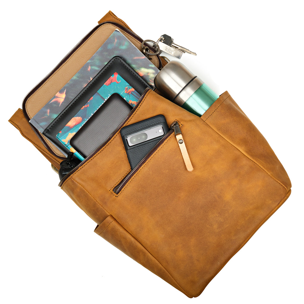 All in One Backpack Medium in Tobacco, packed with a tablet, phone, water bottle and keys