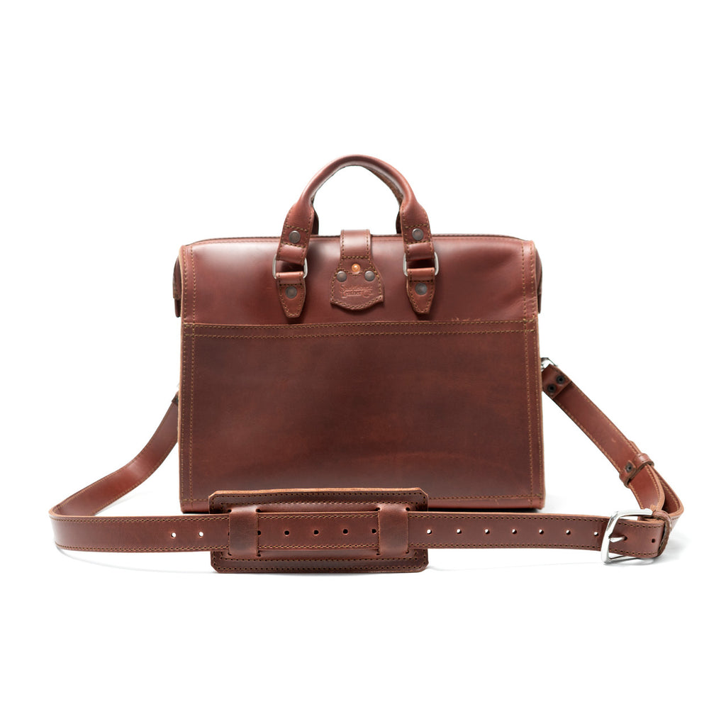 Flight Bag Leather Briefcase in chestnut, back view with slip pocket and padded shoulder strap