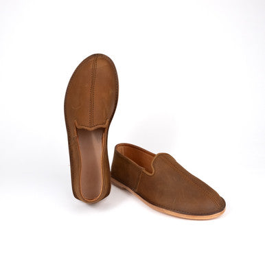 Pair of Barefoot Slip-on Shoes in Tobacco, one upright showing the inside, front angled view