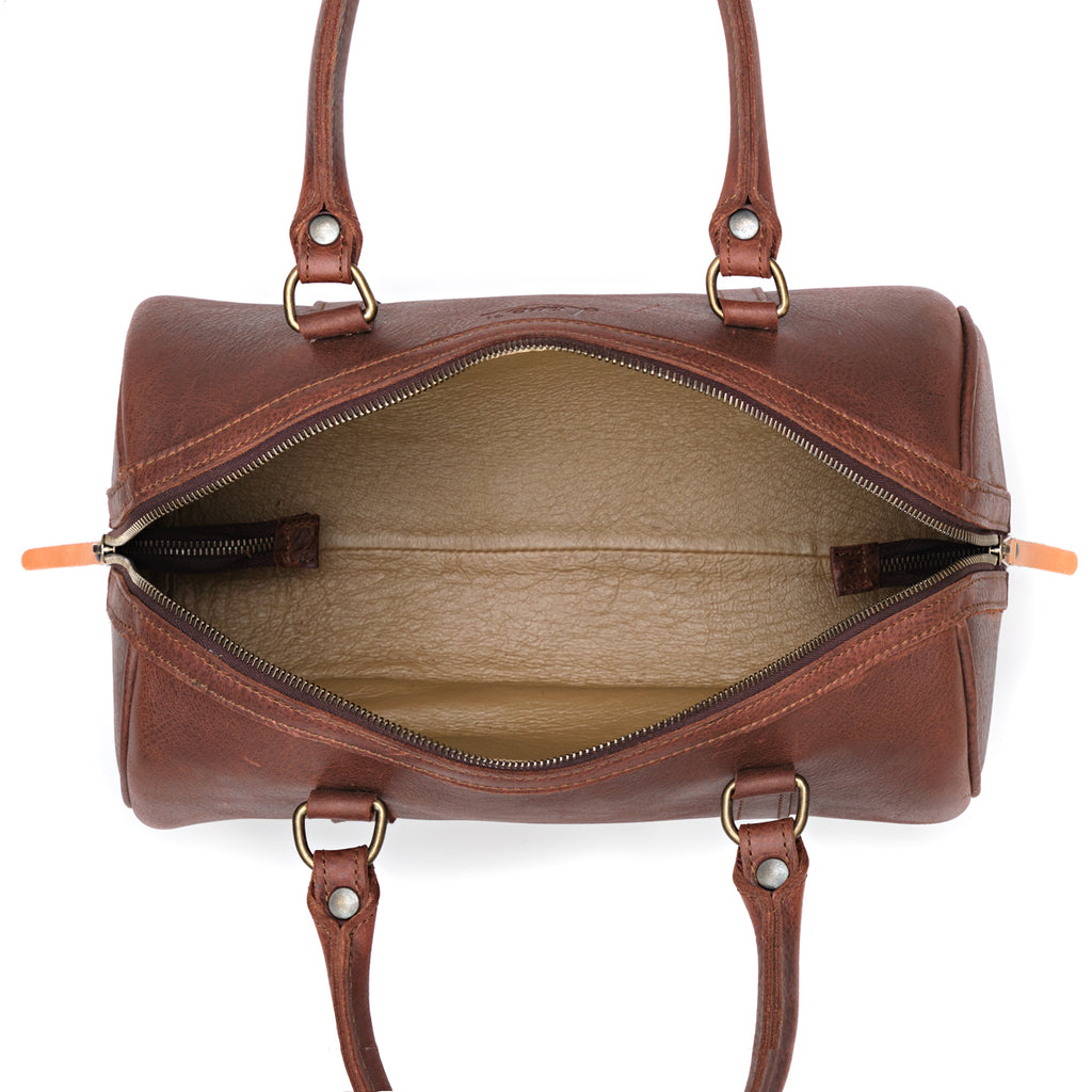 Everyday Barrel Bag in Chestnut, top-down view unzipped showing the lined interior