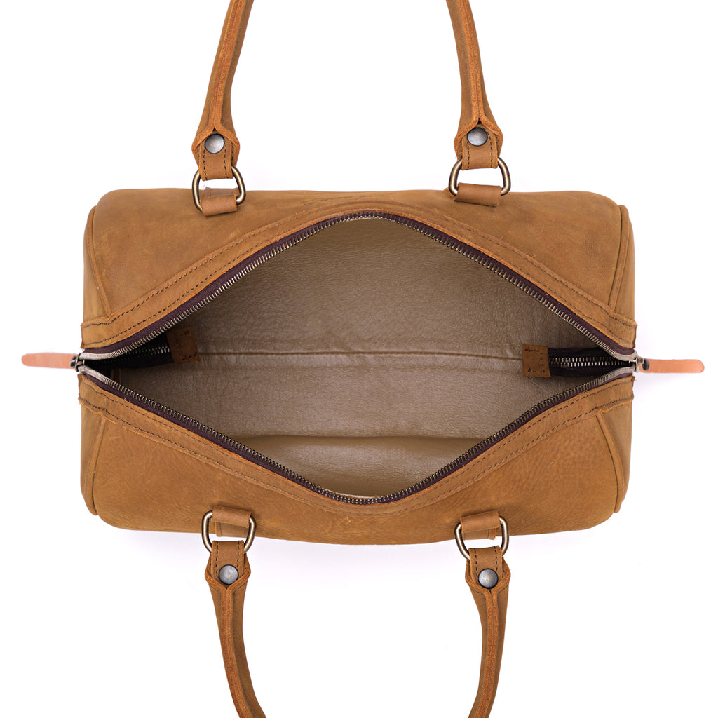 Everyday Barrel Bag in Tobacco, top-down view unzipped showing the lined interior