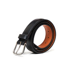 Italian Dress Belt in Raven Black, coiled to show the silver buckle and tan underside