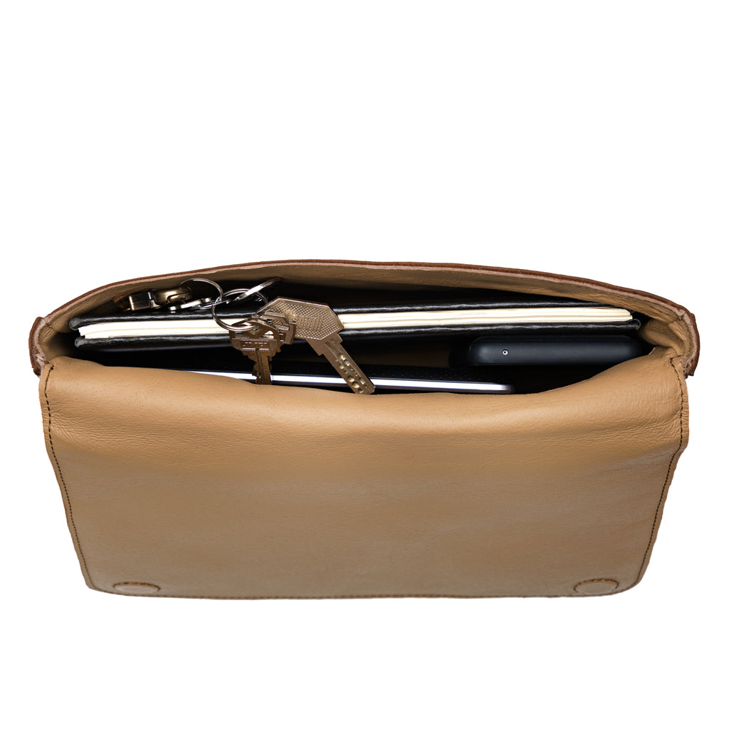 Magnetic Fold Over Bag Large in Dark Coffee Brown, close-up of the open top with suede lining holding a laptop and keys
